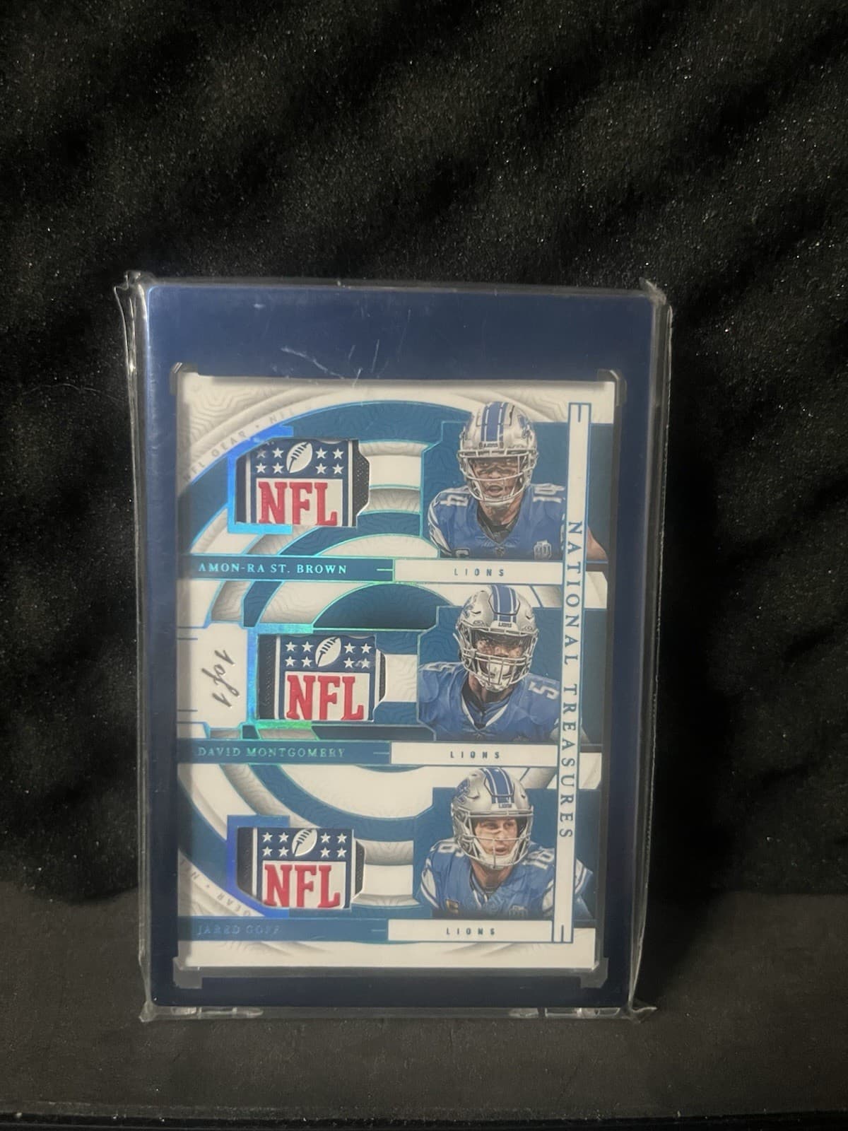 2023 Panini National Treasures NFL Gear Trio NFL shield 1/1 #GTM-DET Lions