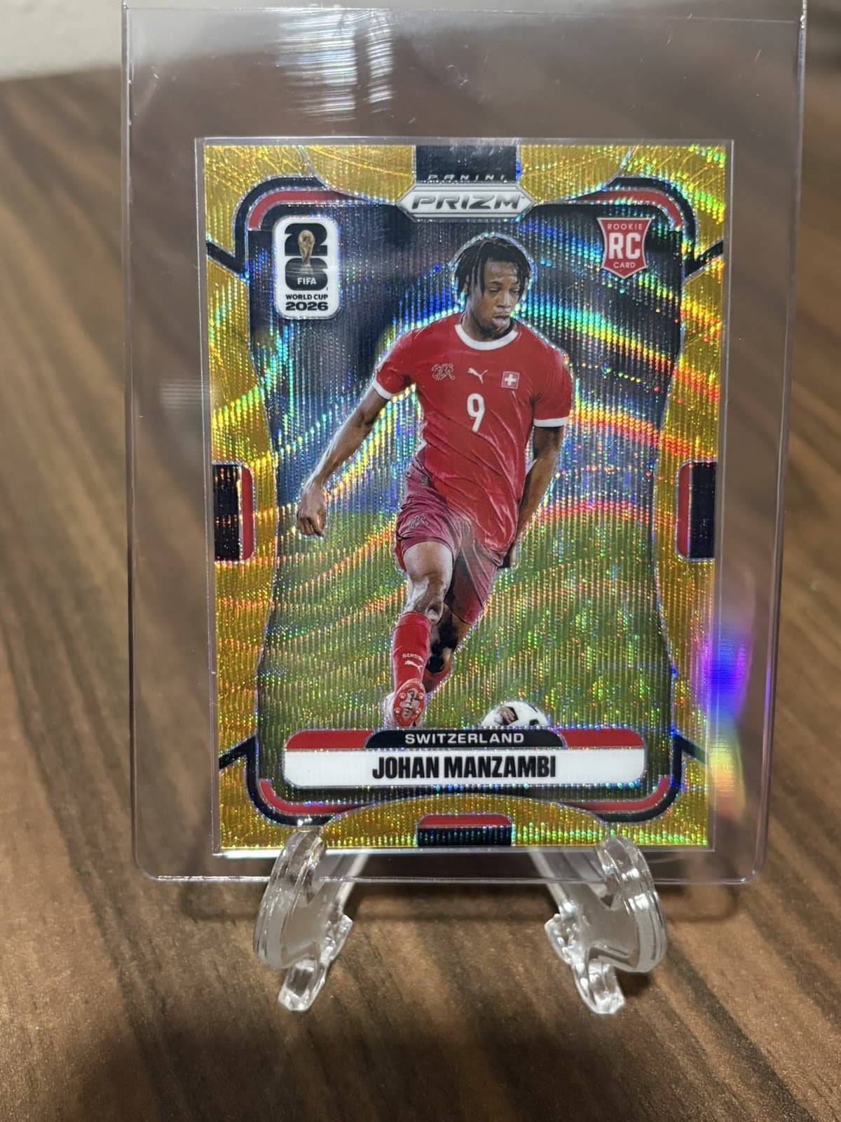 2026 Panini Prizm World Cup Johan Manzambi Gold Wave Prizm /10 Rookie